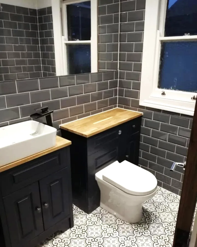 Bathroom: tiled walls and vanity