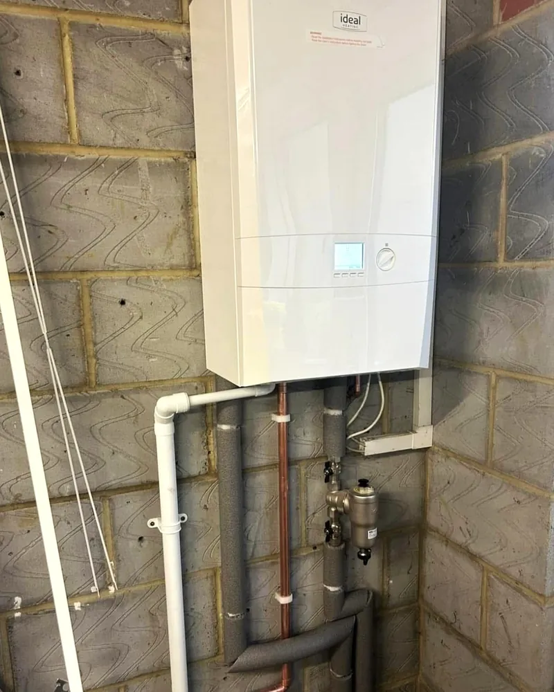 Boiler on a block wall, tidy pipe run